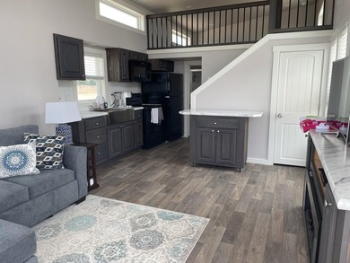 Enjoy lakefront living at its best in this charming tiny home - photo 2