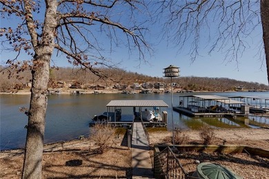 Nestled at the 8 MM in Buck Creek Cove, this lakefront retreat - photo 3