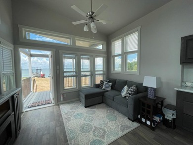Enjoy lakefront living at its best in this charming tiny home - photo 3