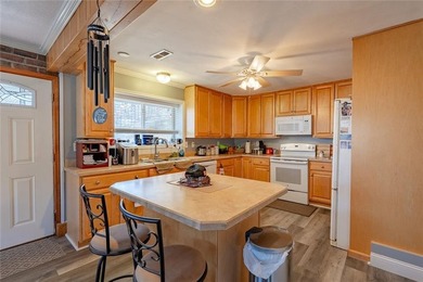 Nestled at the 8 MM in Buck Creek Cove, this lakefront retreat - photo 10