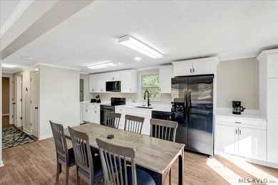 A renovated ranch on the shores of Poplar Creek. Privacy awaits