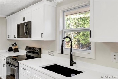 A renovated ranch on the shores of Poplar Creek. Privacy awaits