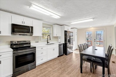 A renovated ranch on the shores of Poplar Creek. Privacy awaits