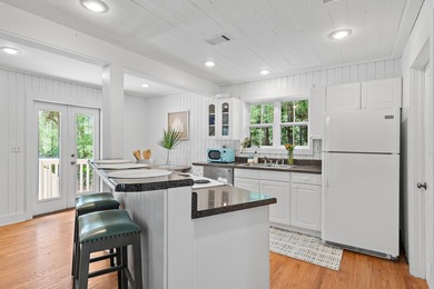 NO HOA AND OVER A HALF ACRE LOT! Bordered by lush vegetation and - photo 9