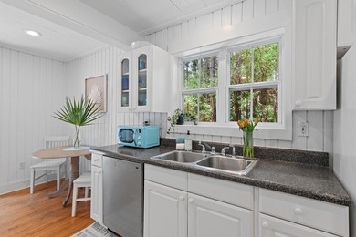 NO HOA AND OVER A HALF ACRE LOT! Bordered by lush vegetation and - photo 10
