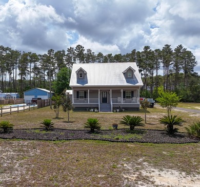 Welcome to your private coastal retreat! Built in 2017, this - photo 1