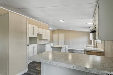 Welcome to this beautifully updated 4-bedroom, 2-bathroom mobile - photo 3