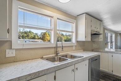 Welcome to this beautifully updated 4-bedroom, 2-bathroom mobile - photo 4
