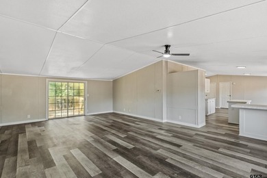 Welcome to this beautifully updated 4-bedroom, 2-bathroom mobile - photo 5
