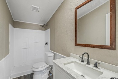 Welcome to this beautifully updated 4-bedroom, 2-bathroom mobile - photo 8