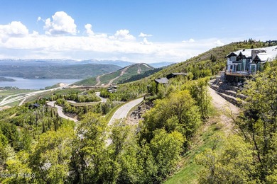 Nestled in the exclusive gated community of Deer Crest, this - photo 9