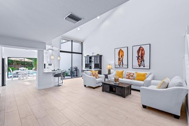 Explore an exceptional 3-bedroom plus den/bonus room, 4.5-bath - photo 1