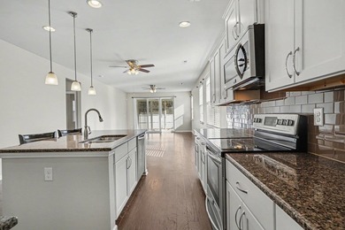This well-designed three-bedroom, two-bathroom home features an - photo 6