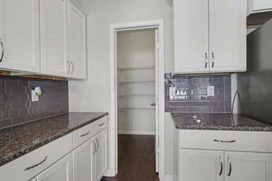 This well-designed three-bedroom, two-bathroom home features an - photo 9