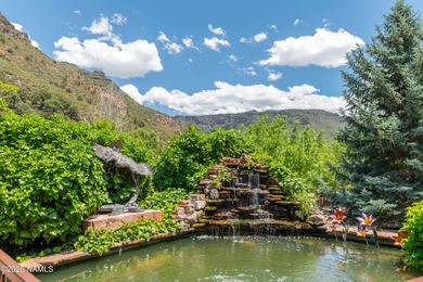 Set beneath the canopy of mature pines and just steps from the - photo 2