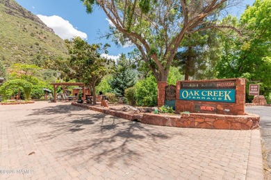 Set beneath the canopy of mature pines and just steps from the - photo 3