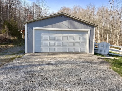 This charming home sits on 1 acre of unrestricted land, offering