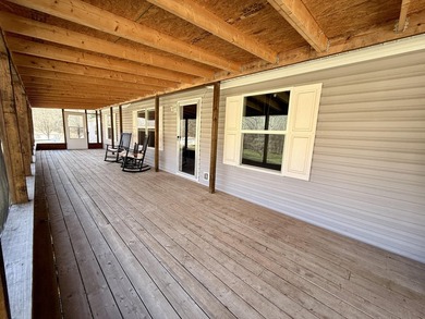 This charming home sits on 1 acre of unrestricted land, offering