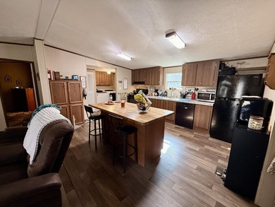 This charming home sits on 1 acre of unrestricted land, offering