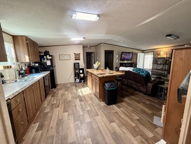 This charming home sits on 1 acre of unrestricted land, offering