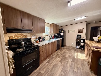 This charming home sits on 1 acre of unrestricted land, offering