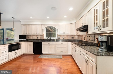 Tucked away on five private acres with a stream that feeds into - photo 13