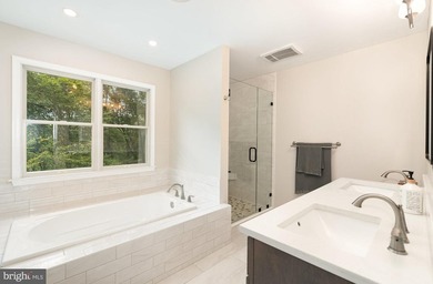 Tucked away on five private acres with a stream that feeds into - photo 17