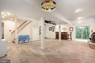 Tucked away on five private acres with a stream that feeds into - photo 30
