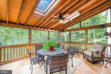 Tucked away on five private acres with a stream that feeds into - photo 38