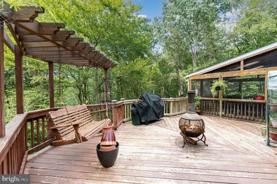 Tucked away on five private acres with a stream that feeds into - photo 39