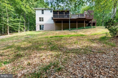 Tucked away on five private acres with a stream that feeds into - photo 41