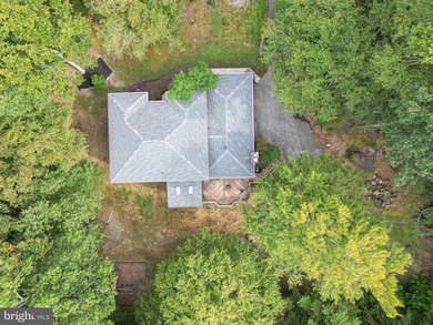Tucked away on five private acres with a stream that feeds into - photo 42