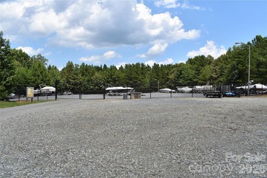This Badin Lake water view lot is located in the prestigious - photo 22