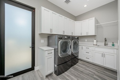 This newly constructed, single-story residence in the exclusive - photo 24