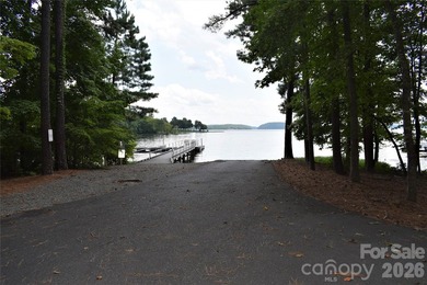 This Badin Lake water view lot is located in the prestigious - photo 27
