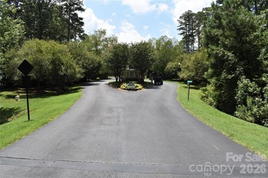 This Badin Lake water view lot is located in the prestigious - photo 28