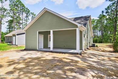 New Construction. Open floor plan with split bedrooms, covered - photo 34