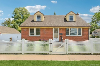 Welcome to 2877 Calvin, a classic cape style residence nestled - photo 1