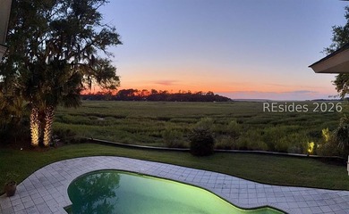 This gorgeous home is uniquely situated on nearly an acre