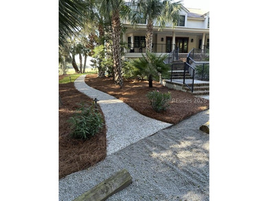 This gorgeous home is uniquely situated on nearly an acre