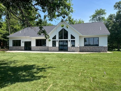 Enjoy lake living with sunrise and sunsets & new construction - photo 1
