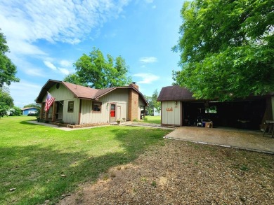 Nestled on .49 acres and situated within a community boat ramp - Lake Home For Sale in Hemphill, Texas