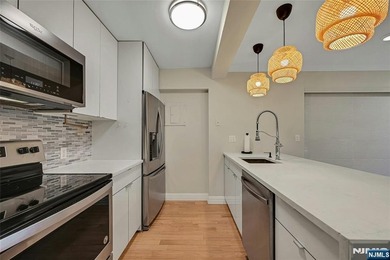 This professionally updated 1-bedroom, first-floor unit at