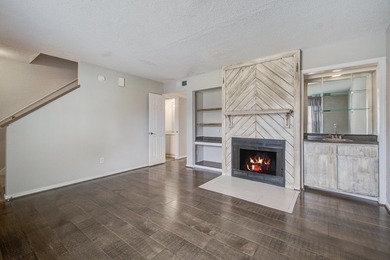 Move in ready two bedroom townhouse featuring a cozy fireplace - photo 7