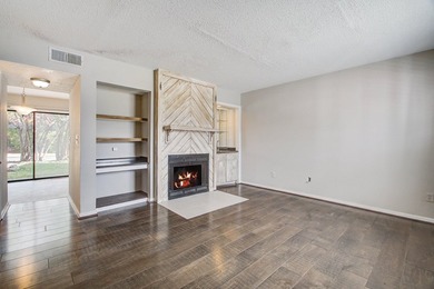 Move in ready two bedroom townhouse featuring a cozy fireplace - photo 8