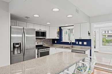 Waterfront with stunning views, a rare 3-bedroom, 3.5-bath with - photo 8