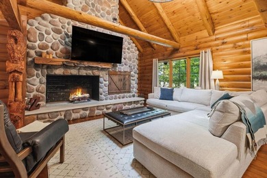 Discover lakeside living in this inviting log cabin on - photo 11