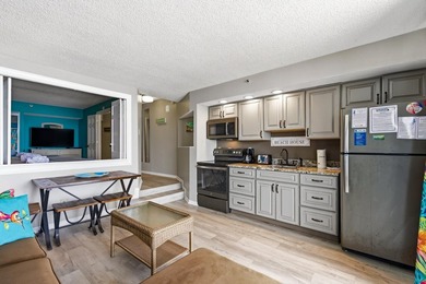 Dive into oceanfront luxury with this stylishly renovated - photo 7