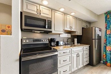 Dive into oceanfront luxury with this stylishly renovated - photo 8