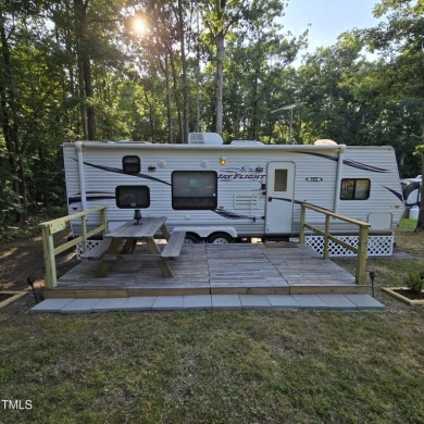 Escape to your own private retreat at 103 KiKi Lane in the - Lake Lot For Sale in Louisburg, North Carolina